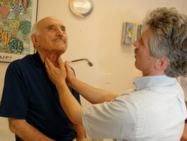 Health care provider checking patients lymph nodes